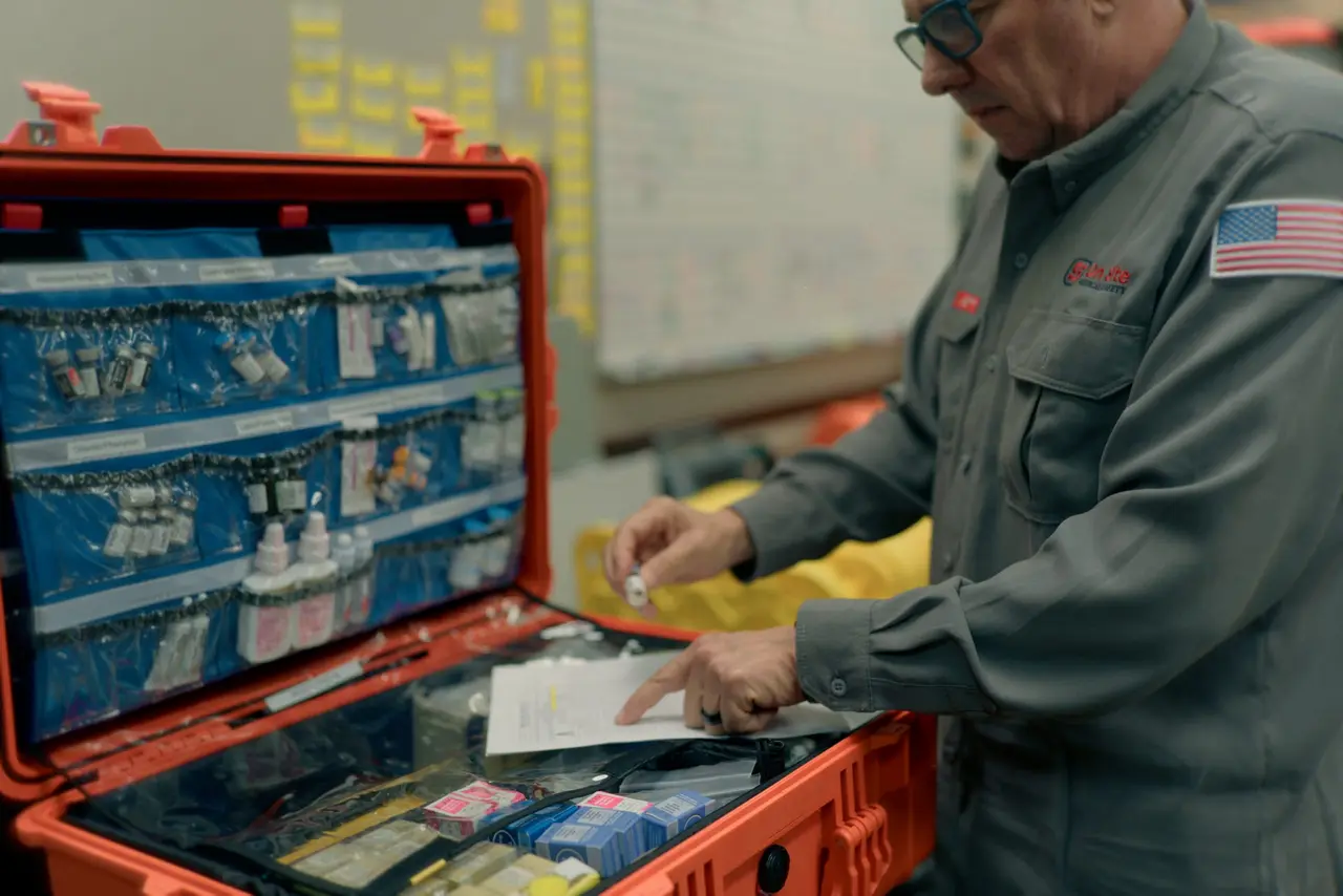 Labeled medication inventory being checked and reconciled in an offshore sick bay