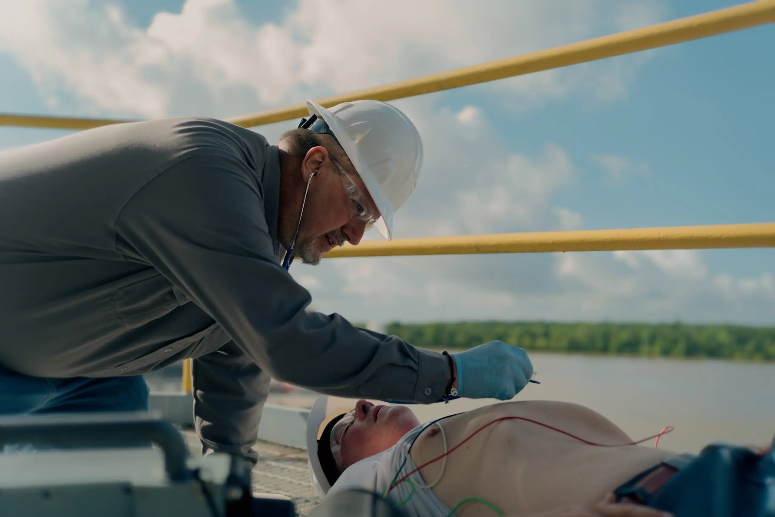 An On Site paramedic stabilizing a patient with cardiac monitoring